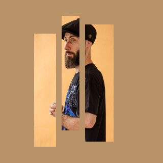 A bearded man in a black cap and t-shirt stands in profile, shown through three vertical bars on a tan background. Text on the right says 